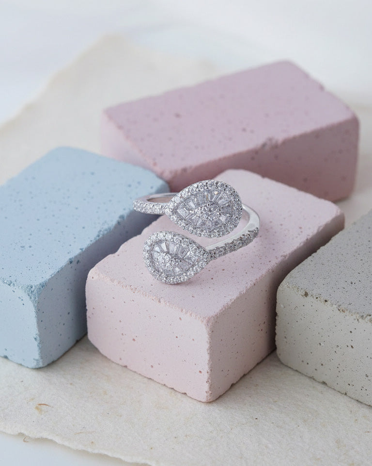 pear shape open ring with trapezoid and round CZ.