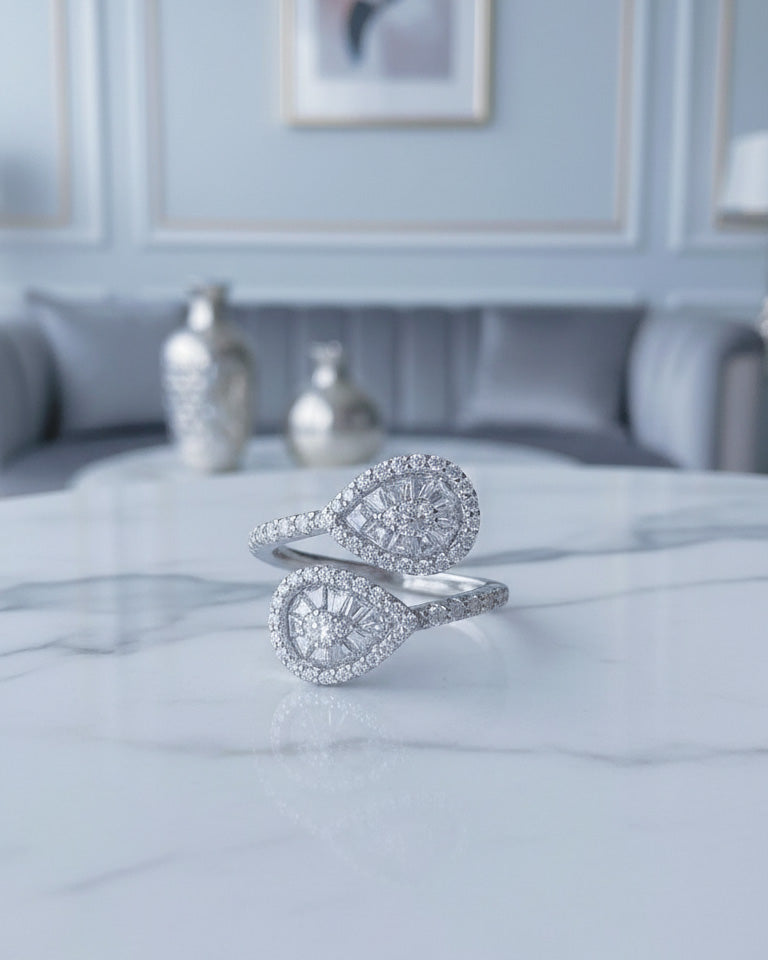 pear shape open ring with trapezoid and round CZ.