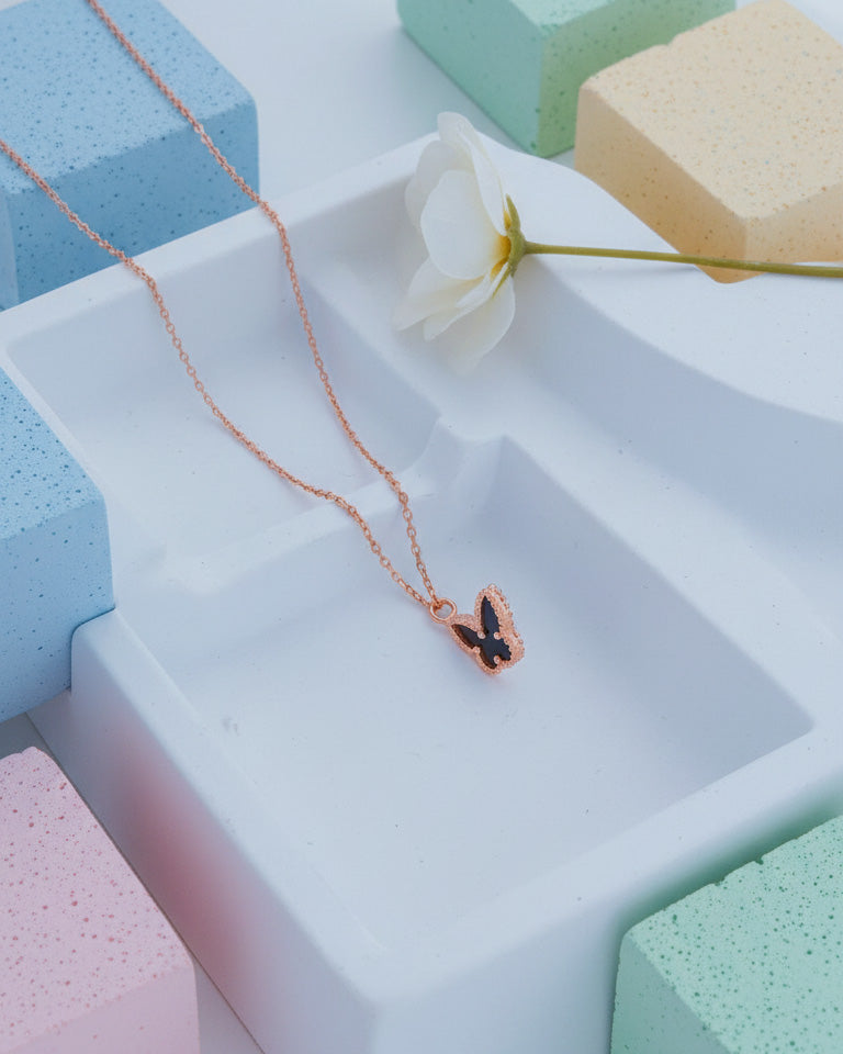 mother of pearl and agate butterfly rosegold necklace.