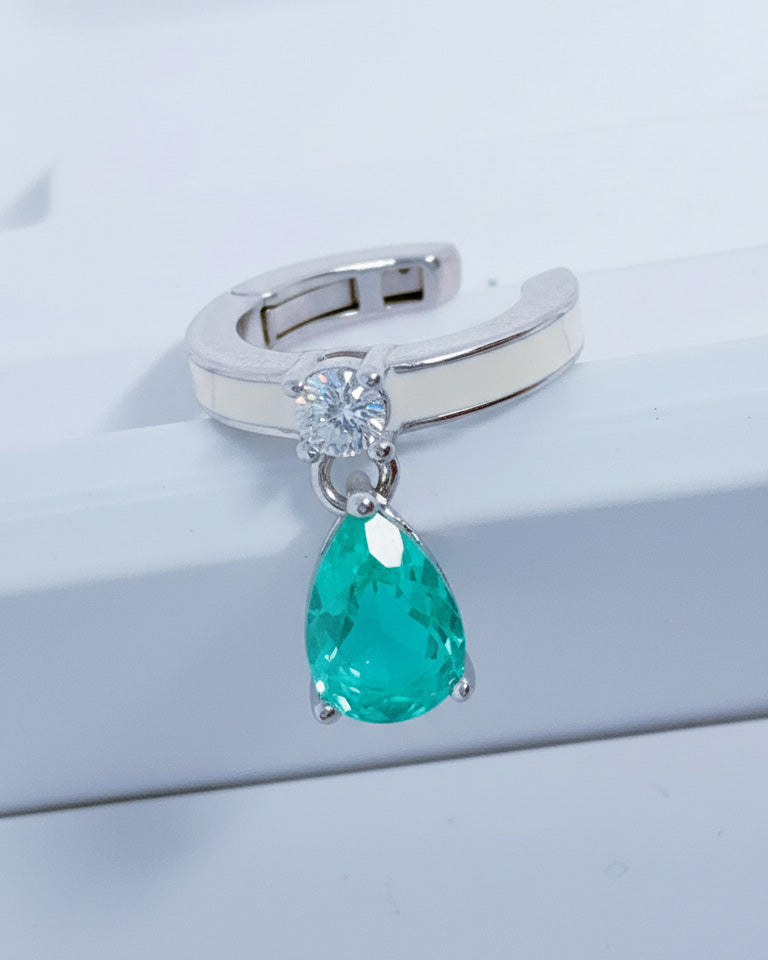 white enamel ear-cuff with dangling green pear shape CZ stone.