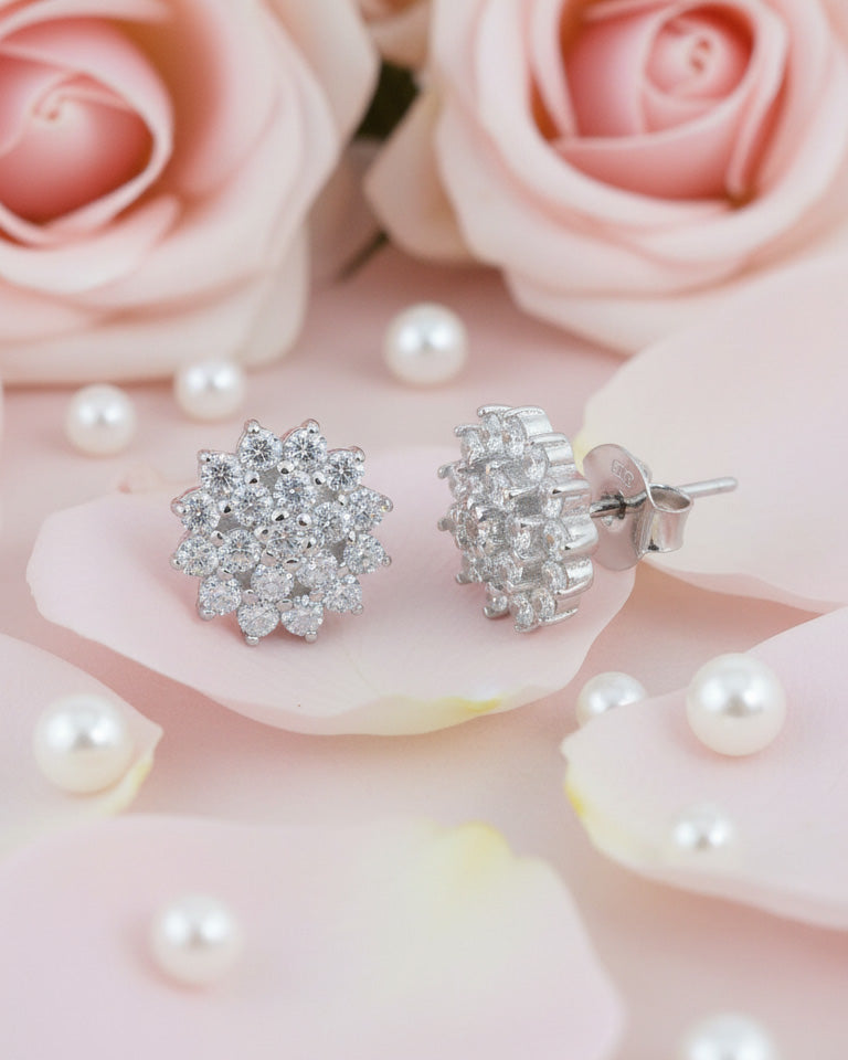 Cluster of round shape CZ in a flower shape stud earring.