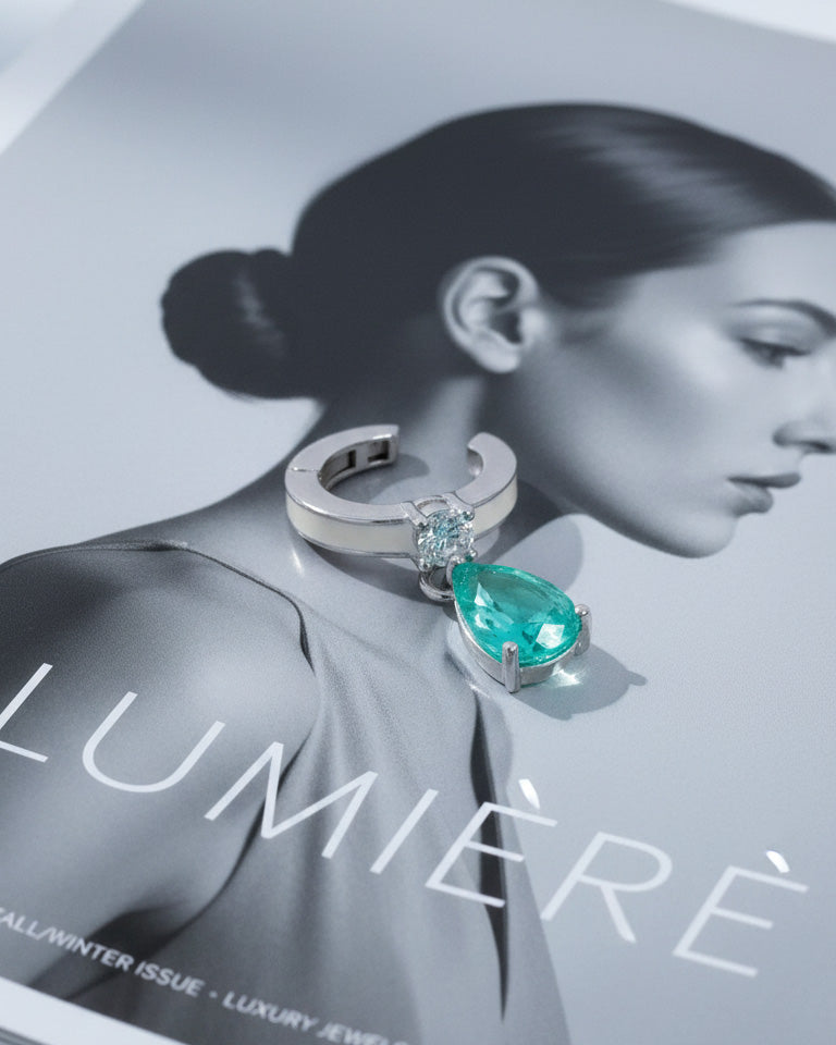 white enamel ear-cuff with dangling green pear shape CZ stone.