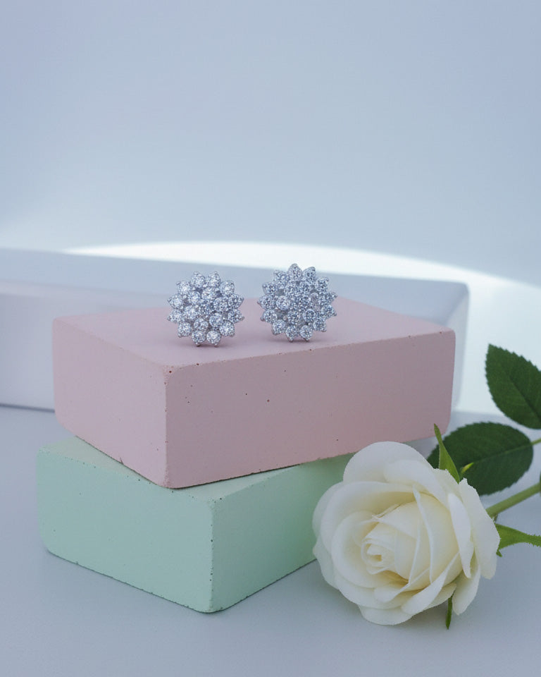 Cluster of round shape CZ in a flower shape stud earring.