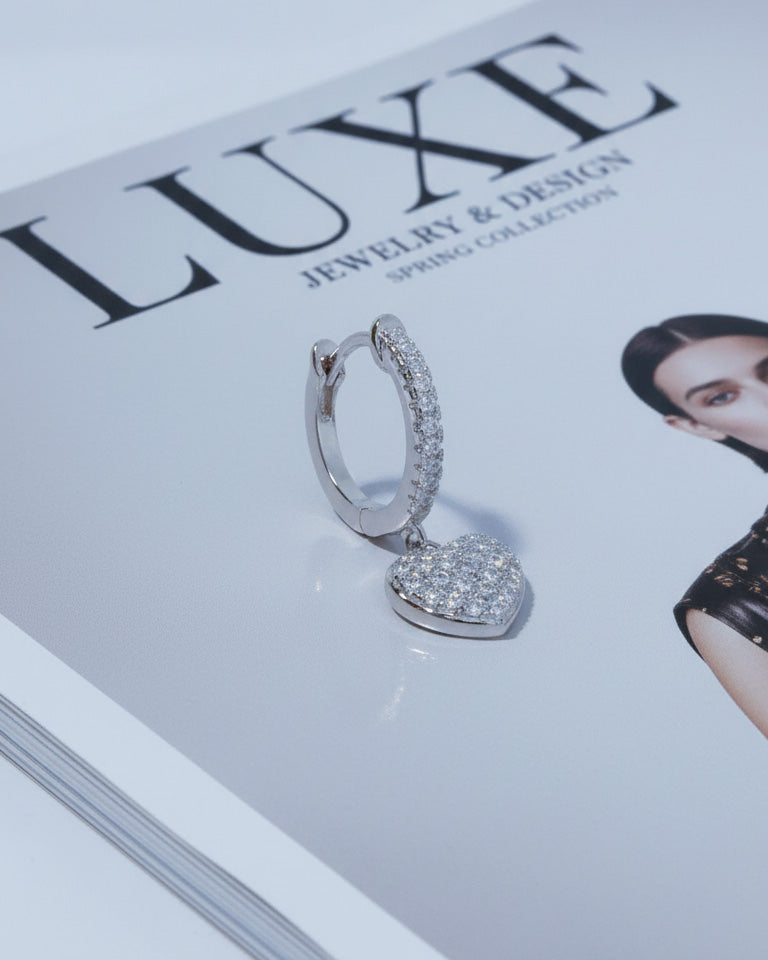 CZ huggie hoop with dangling heart shape.