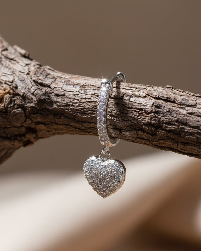 CZ huggie hoop with dangling heart shape.