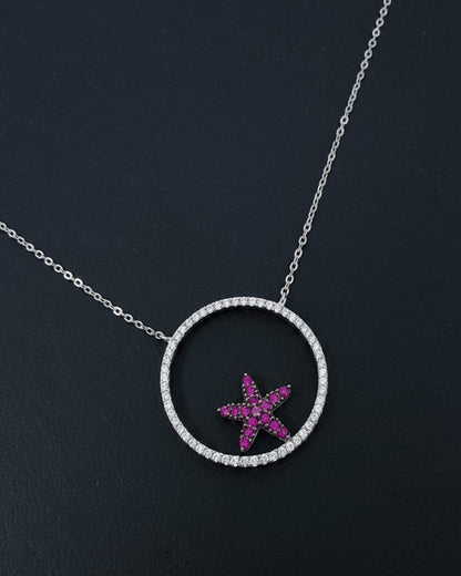 Circle necklace with a ruby color star necklace.