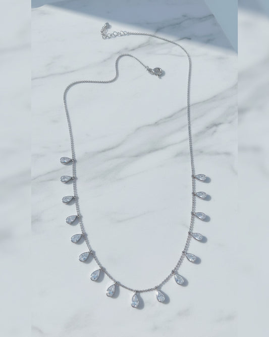 tin faceted beads silver necklace with dangling pear shapes in bezel setting.