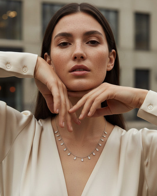 tin faceted beads silver necklace with dangling pear shapes in bezel setting.