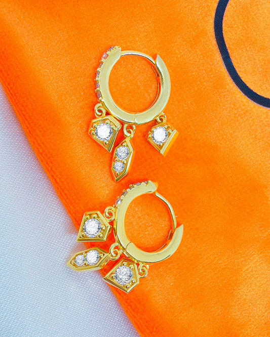 CZ hoop earring with three dangling shapes.