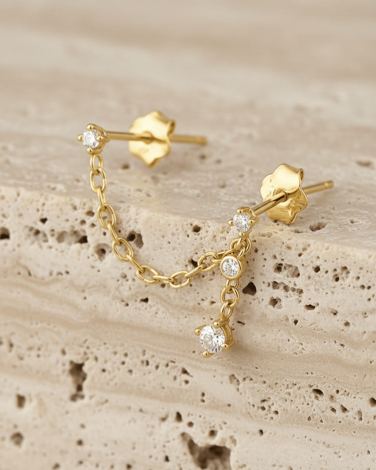 minimal double stud chain earring with dangling chain of two stones.
