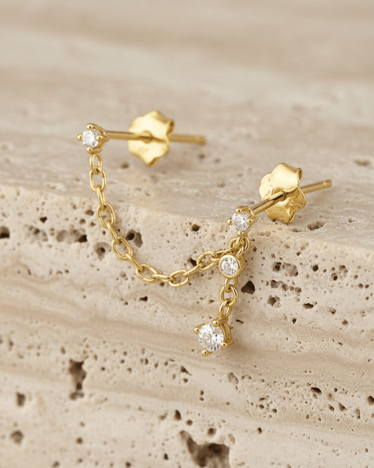 minimal double stud chain earring with dangling chain of two stones.