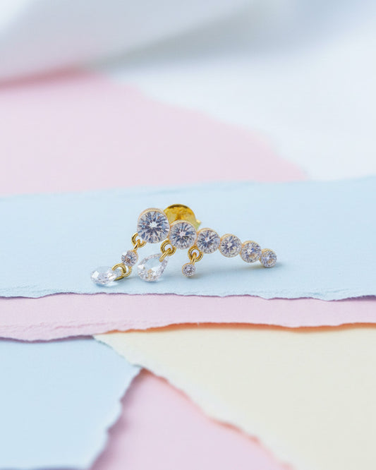 Round graduated CZ bar with dangling pierced pear shapes.