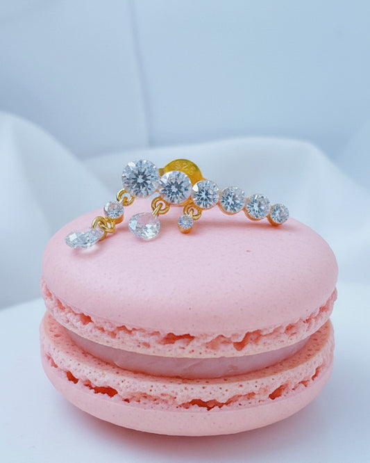 Round graduated CZ bar with dangling pierced pear shapes.