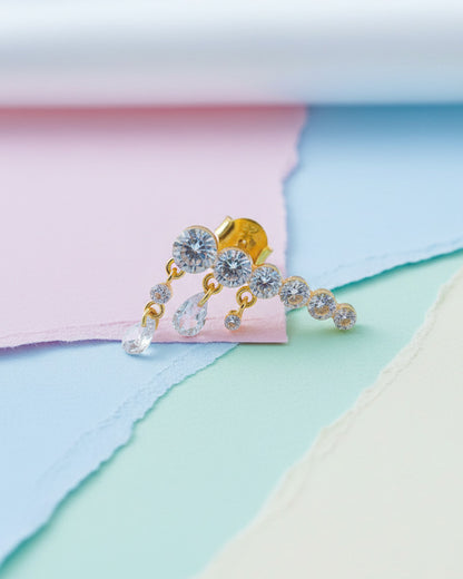 Round graduated CZ bar with dangling pierced pear shapes.