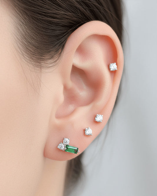 emerald baguette and two white stone stud earring.
