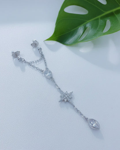 double stud dangling earring with star shape and marquise stones in bezel setting.