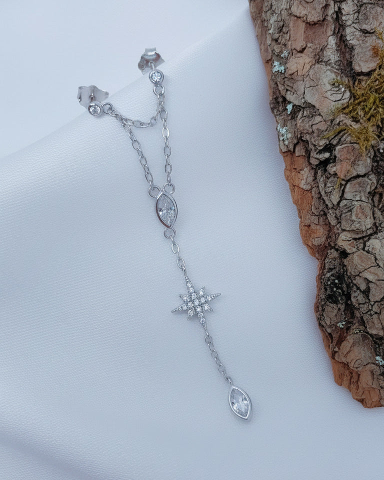 double stud dangling earring with star shape and marquise stones in bezel setting.