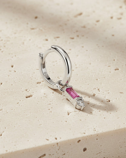 8 mm plain huggie hoop earring with dangling rectangular pink and round white stone.