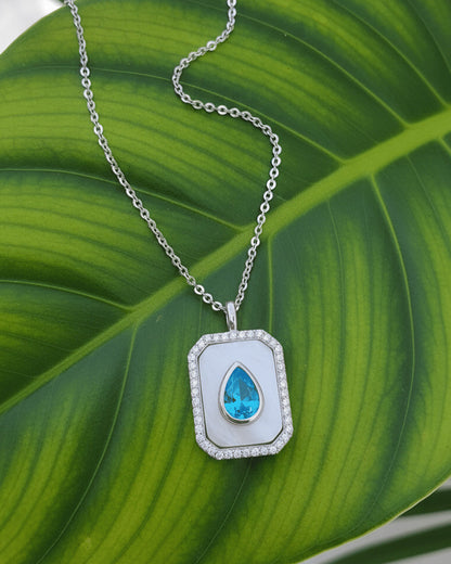 rectangular MOP necklace with pear shape aquamarine color CZ stone.