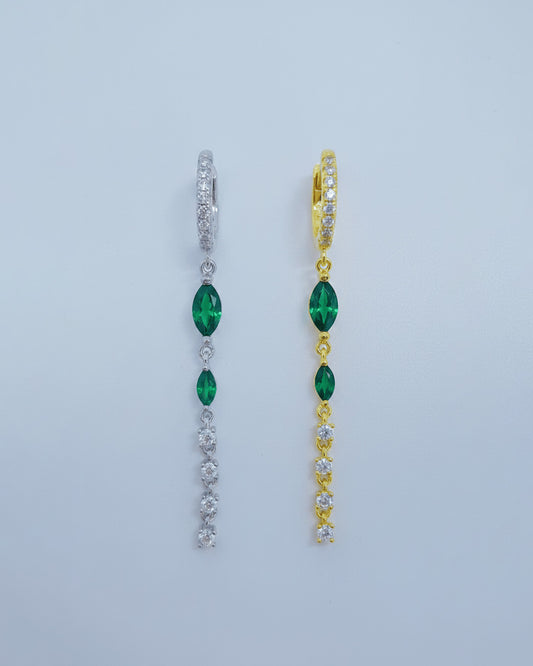 dangling line with two emerald marquise stones hoop.
