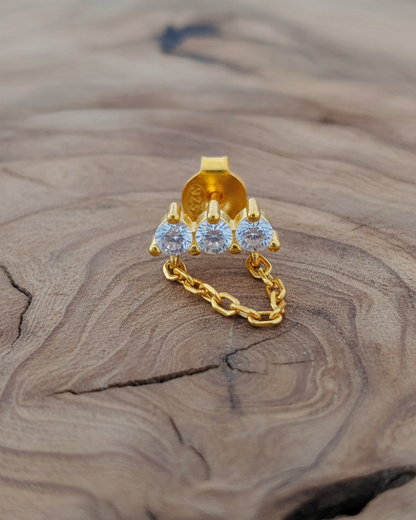 three stones bar earring with dangling chain.