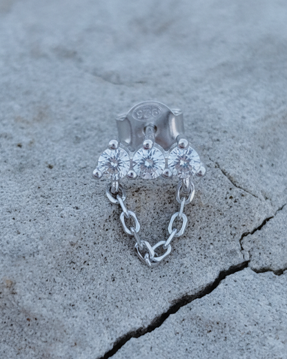 three stones bar earring with dangling chain.