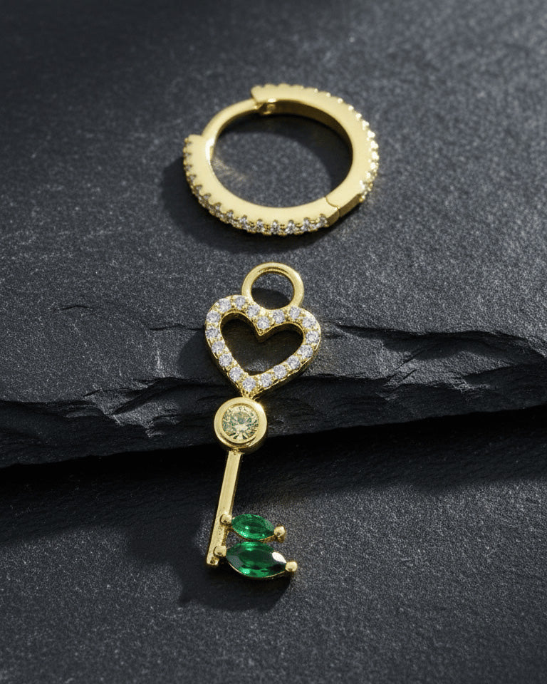 heart key shape dangling huggie hoop earring.