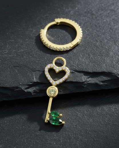 heart key shape dangling huggie hoop earring.
