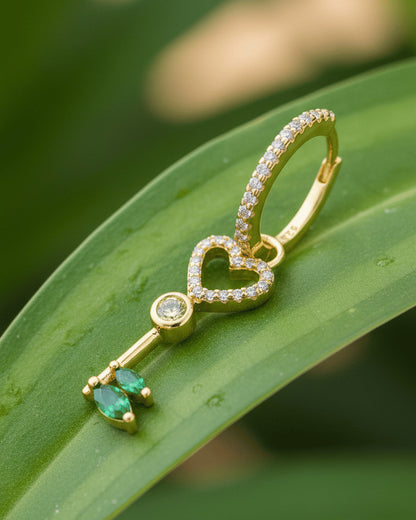 heart key shape dangling huggie hoop earring.