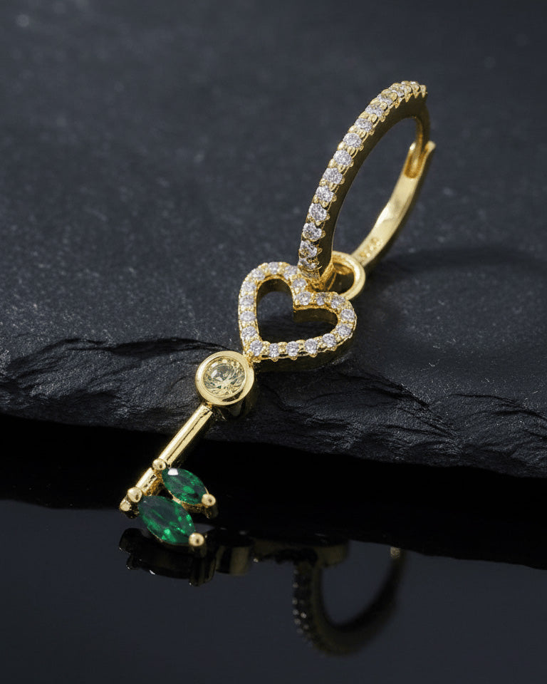 heart key shape dangling huggie hoop earring.