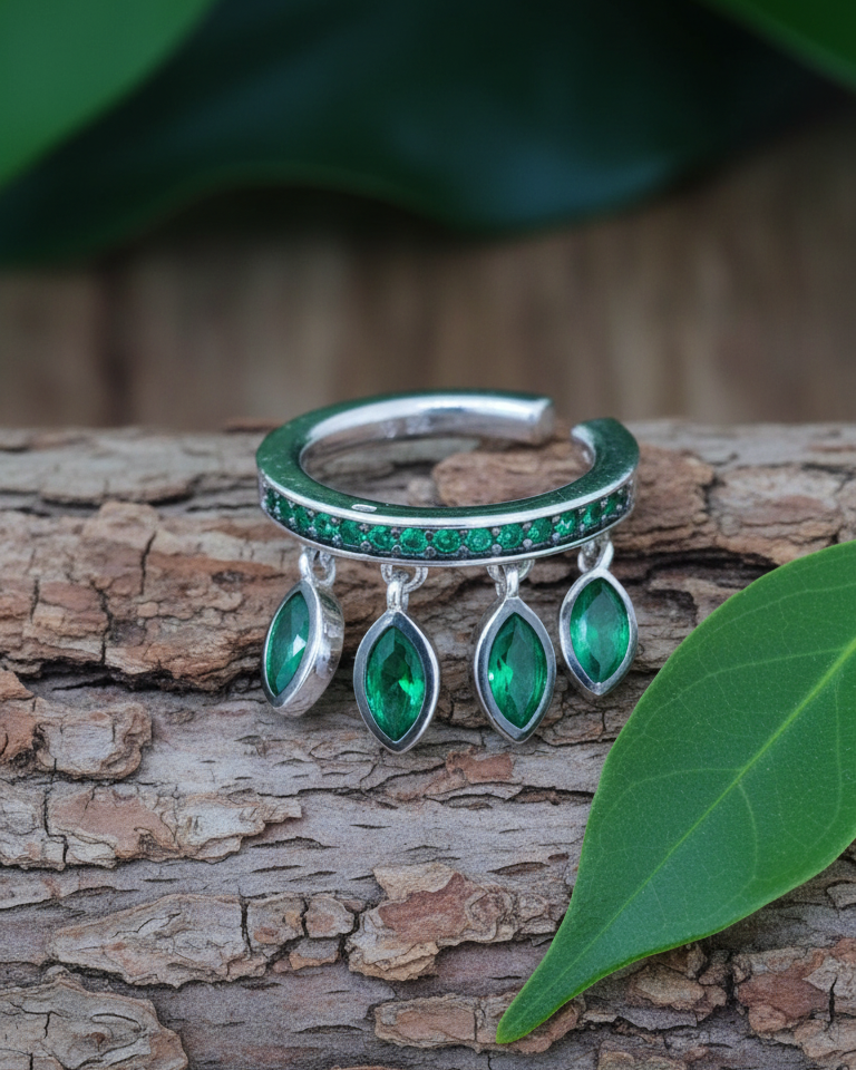 emerald color CZ with dangling marquise shapes.