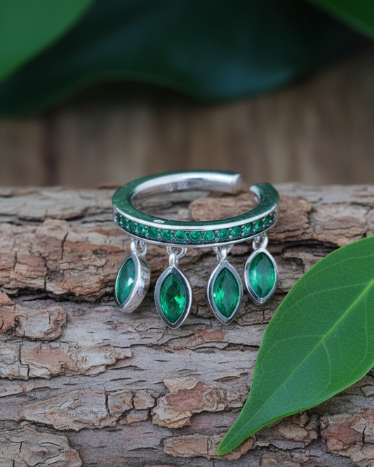 emerald color CZ with dangling marquise shapes.