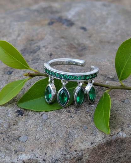 emerald color CZ with dangling marquise shapes.