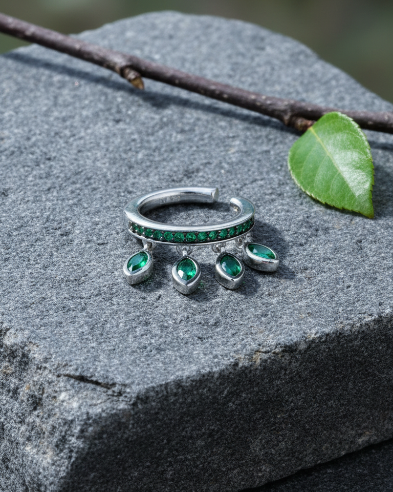 emerald color CZ with dangling marquise shapes.