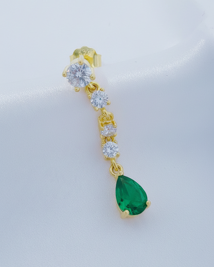 white CZ line ending with emerald color pear shape stud earring.