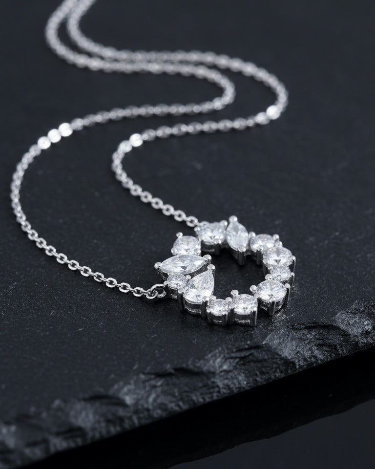 sterling silver circle of love necklace of round and fancy CZ stones.
