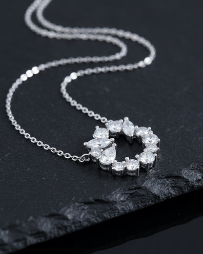 sterling silver circle of love necklace of round and fancy CZ stones.