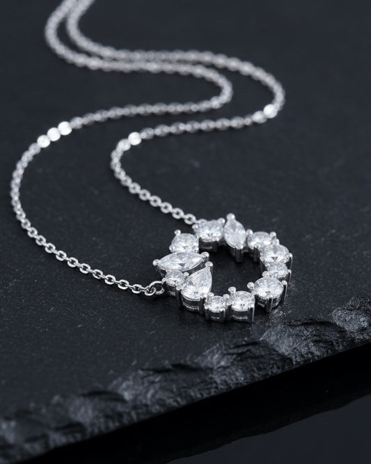 sterling silver circle of love necklace of round and fancy CZ stones.