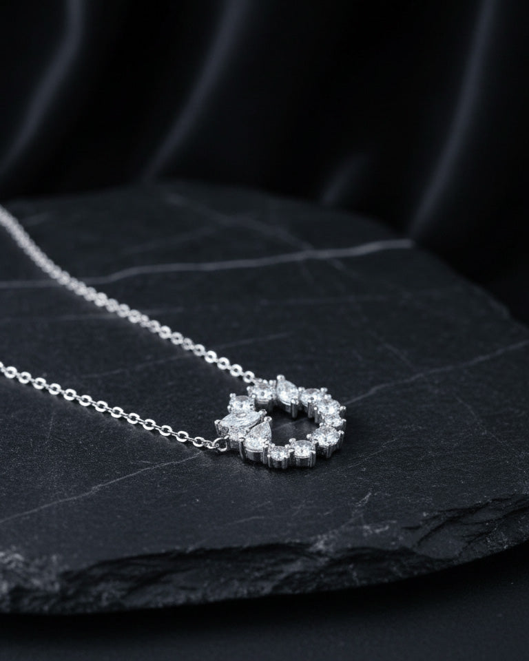 sterling silver circle of love necklace of round and fancy CZ stones.