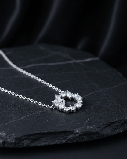 sterling silver circle of love necklace of round and fancy CZ stones.