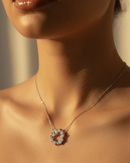 sterling silver circle of love necklace of round and fancy CZ stones.