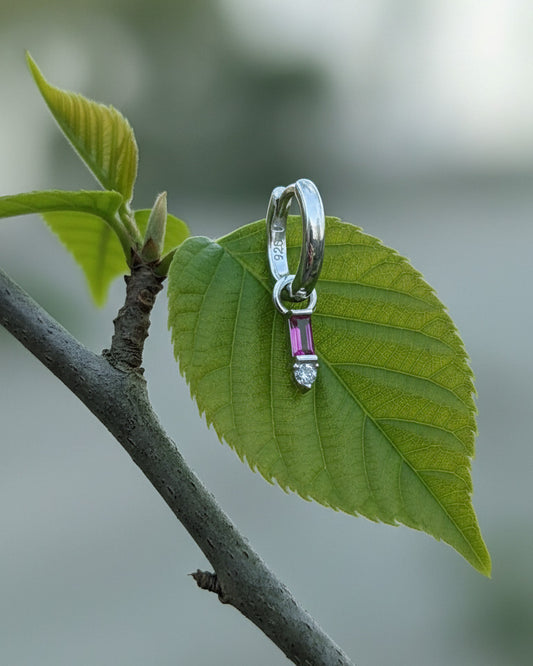 9 mm plain huggie hoops with removable dangling with pink baguette stone.