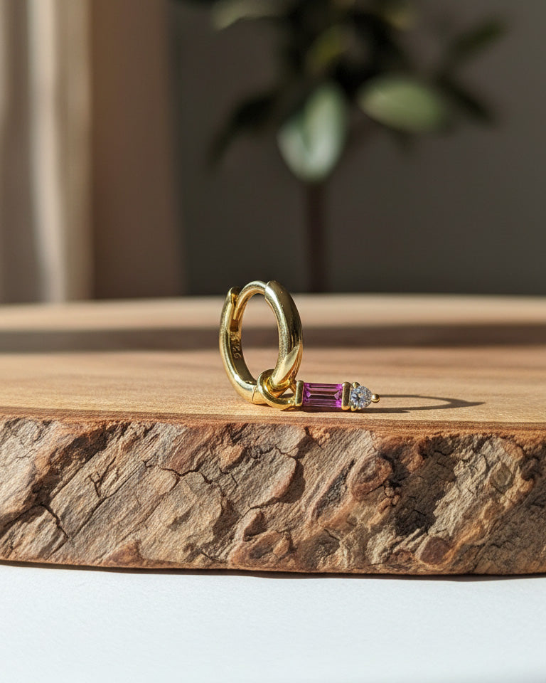 9 mm plain huggie hoops with removable dangling with pink baguette stone.