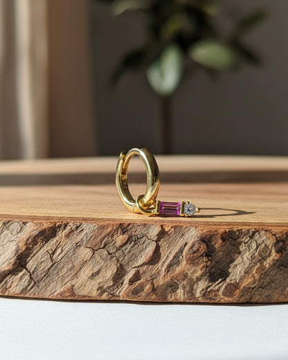 9 mm plain huggie hoops with removable dangling with pink baguette stone.