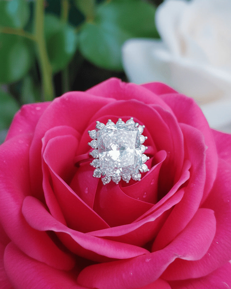 Radiant cur white CZ in halo setting ring.