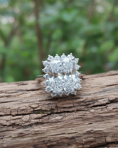 Radiant cur white CZ in halo setting ring.