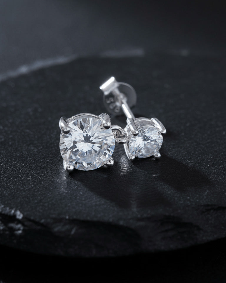 Two graduated round CZ stones stud earring.