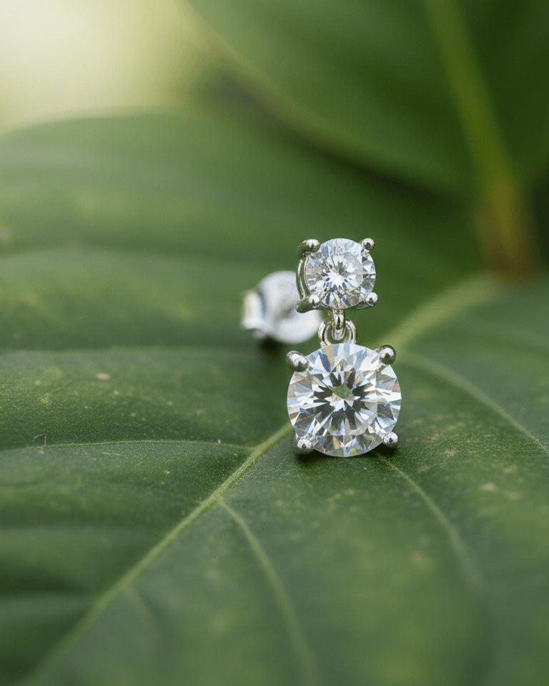 Two graduated round CZ stones stud earring.