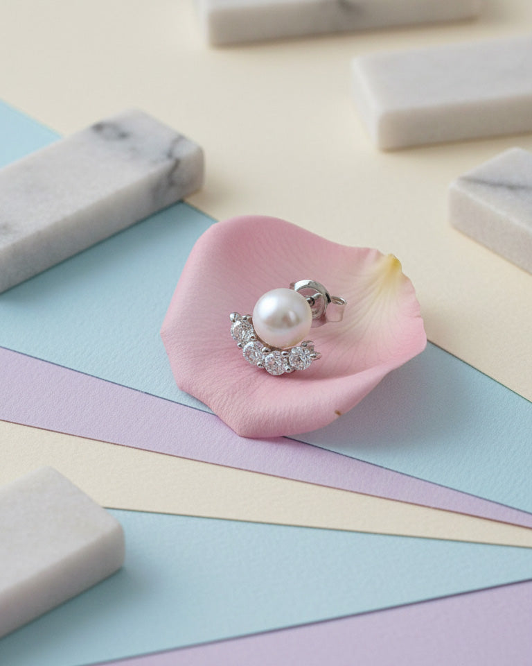 Pearl stud earring with four round CZ stones.