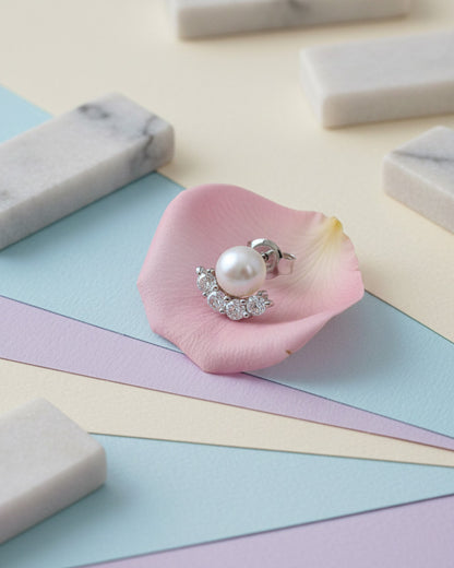 Pearl stud earring with four round CZ stones.